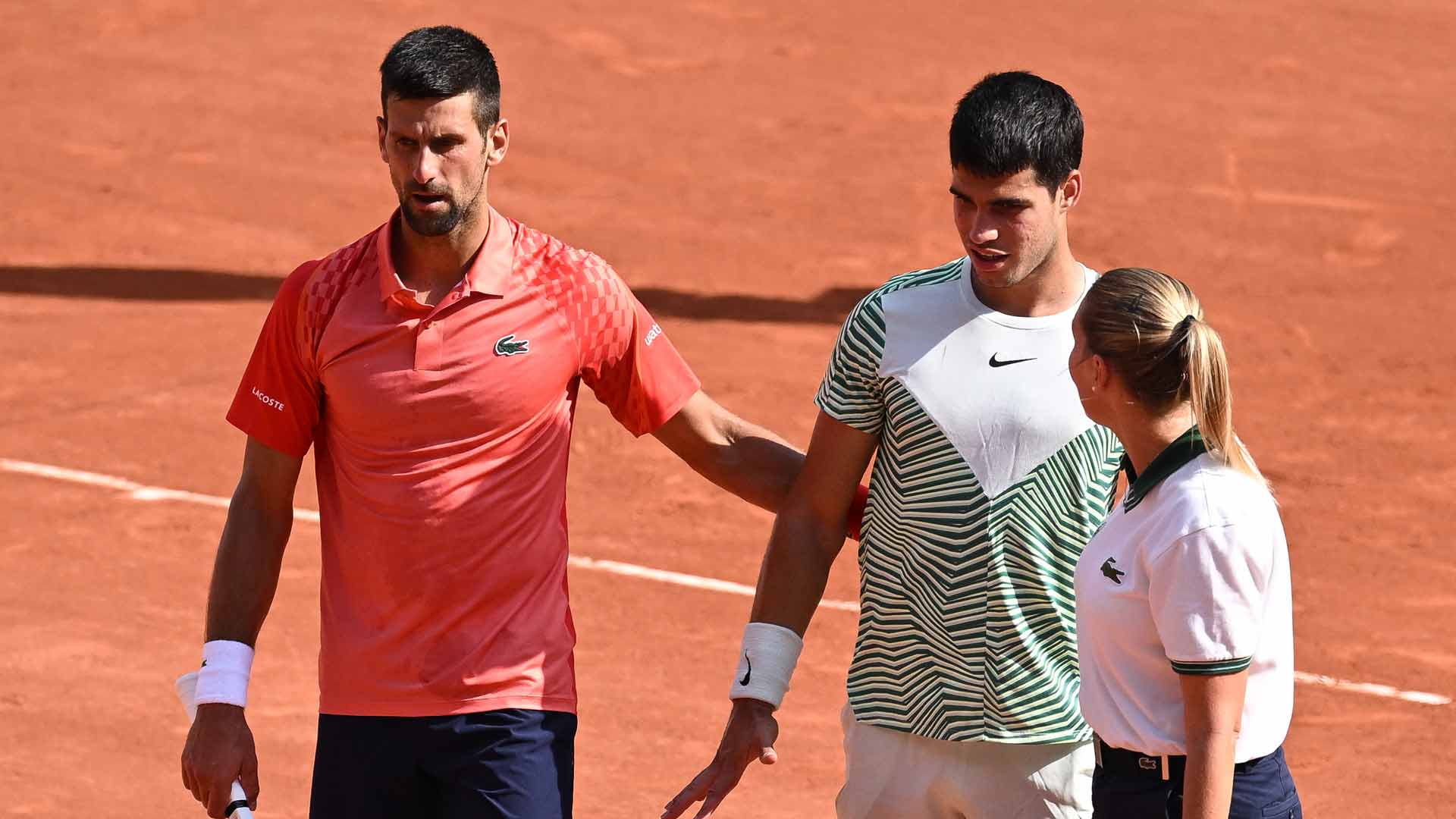 <a href='https://edx.atptour.com/en/players/novak-djokovic/d643/overview'>Novak Djokovic</a> and <a href='https://edx.atptour.com/en/players/carlos-alcaraz/a0e2/overview'>Carlos Alcaraz</a> during their 2023 <a href='https://edx.atptour.com/en/tournaments/roland-garros/520/overview'>Roland Garros</a> semi-final