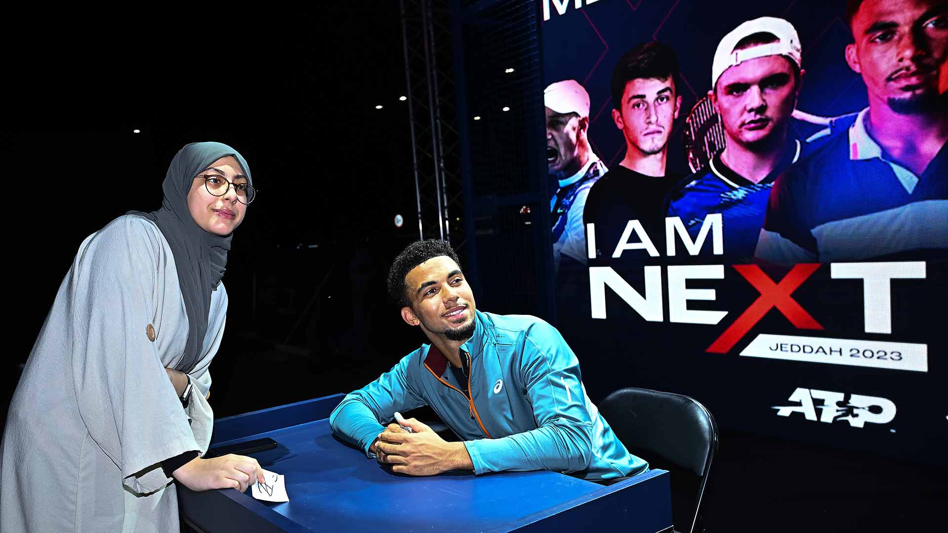 Arthur Fils with a young Saudi tennis fan at the Fan Zone at the Next Gen ATP Finals presented by NEOM in Jeddah.