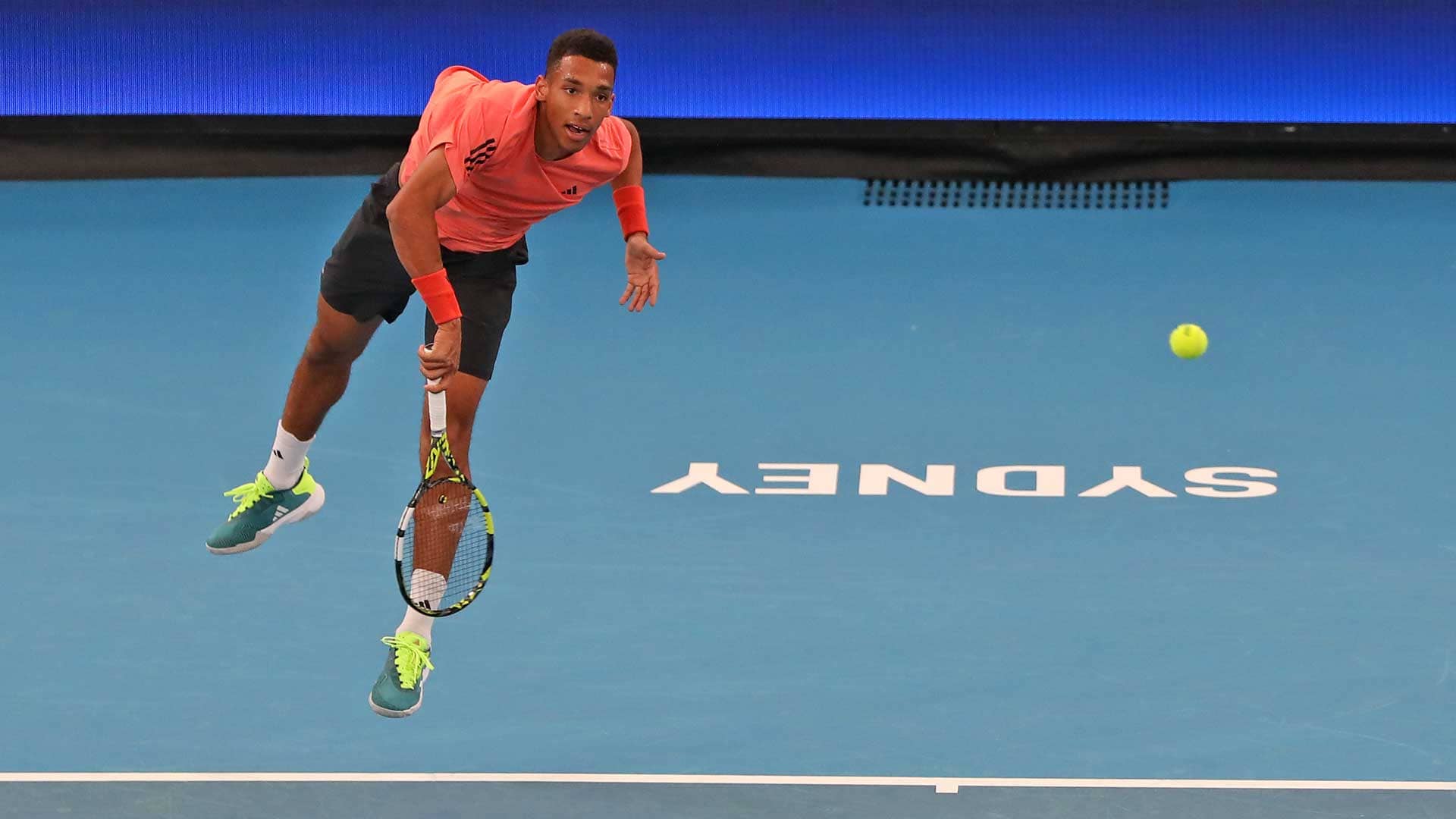 Felix Auger-Aliassime serves to Alexander Zverev on Wednesday during a practice session in Sydney.