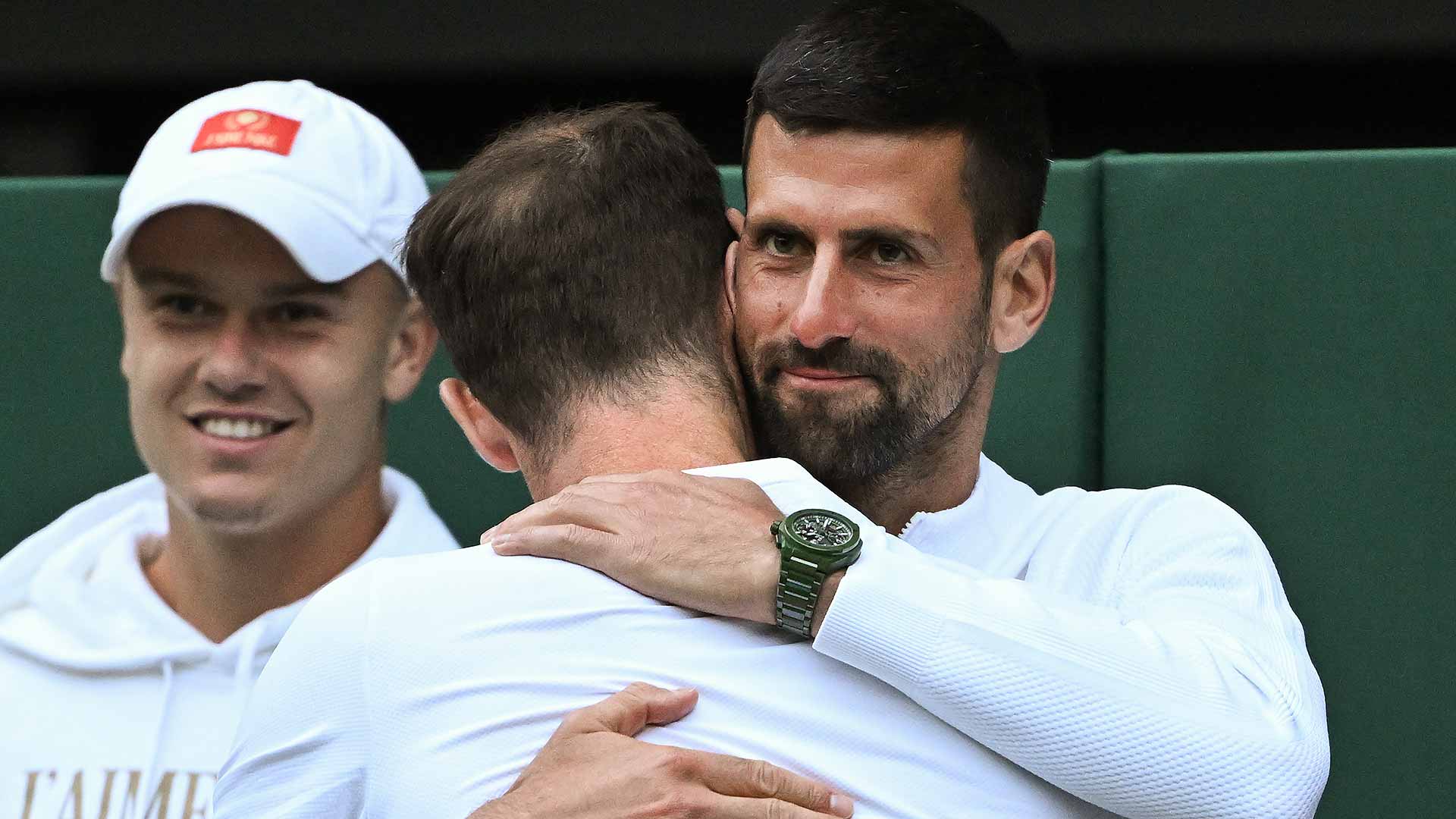 <a href='https://edx.atptour.com/en/players/novak-djokovic/d643/overview'>Novak Djokovic</a> shares an embrace with <a href='https://edx.atptour.com/en/players/andy-murray/mc10/overview'>Andy Murray</a>.